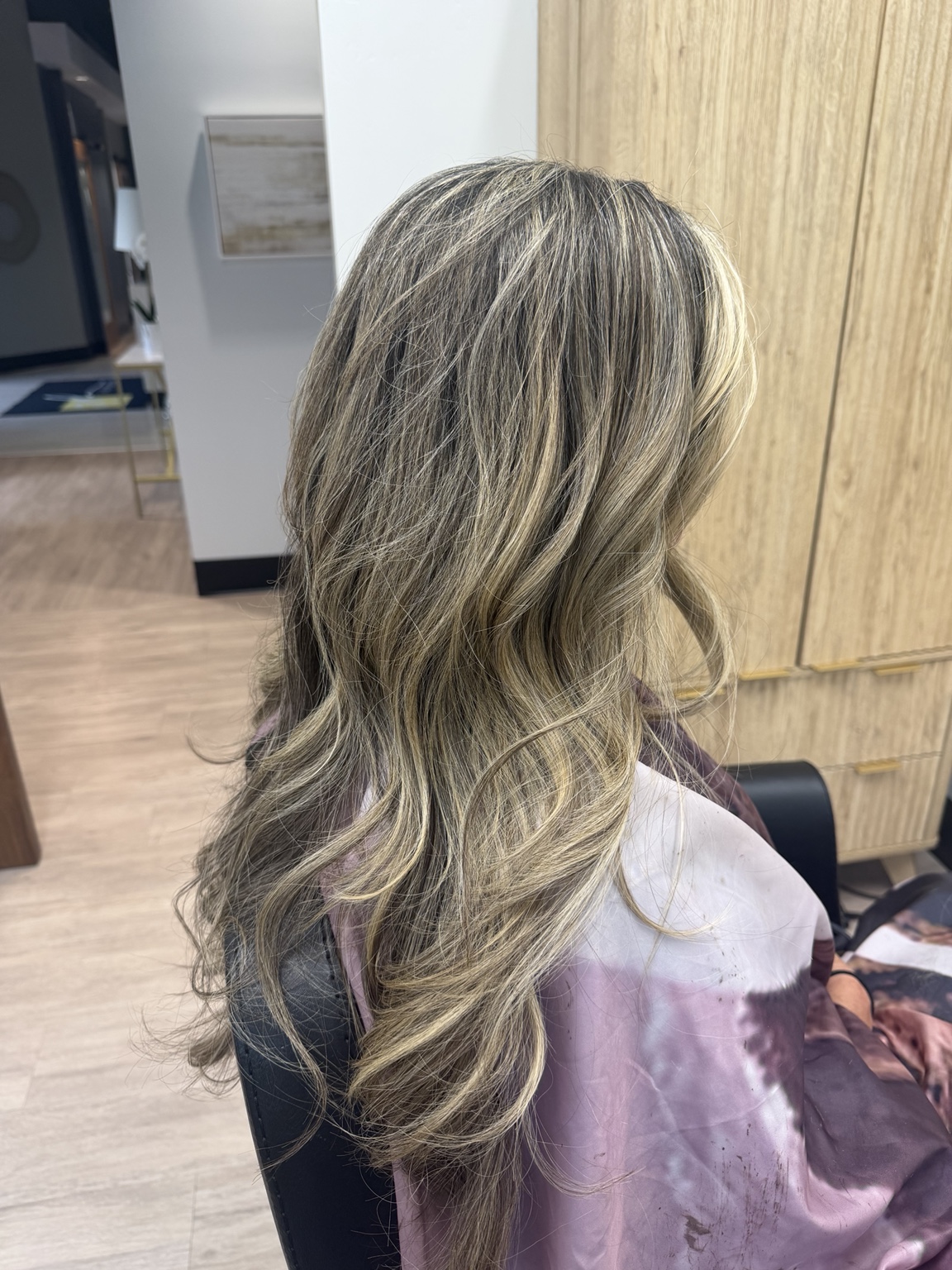 Dimensional blonde hair styled in Paula’s salon